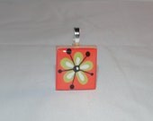 Flower pendant orange background