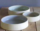 SAMPLE off white low bowls with light colored glaze interior. modern handmade minimalist pottery
