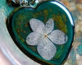 dried flower real pressed flower botanical necklace. heart verdigris patina pendent. white hydrangea.