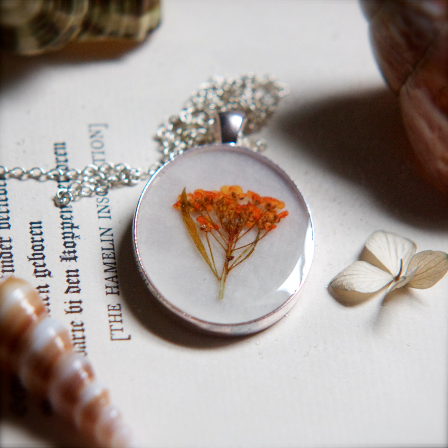 resin jewelry pressed flower necklace. orange beach wildflower pressed botanical. romantic peach