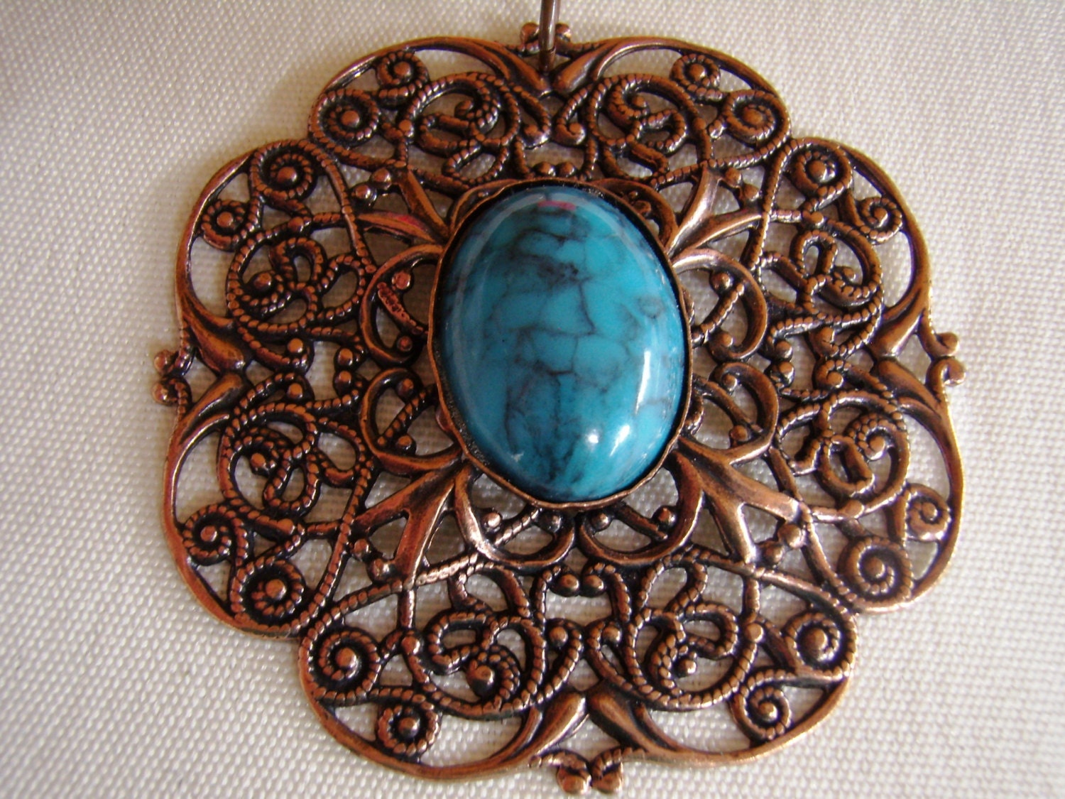 Copper Filligree Pendant with Turquoise like Cabochon Center