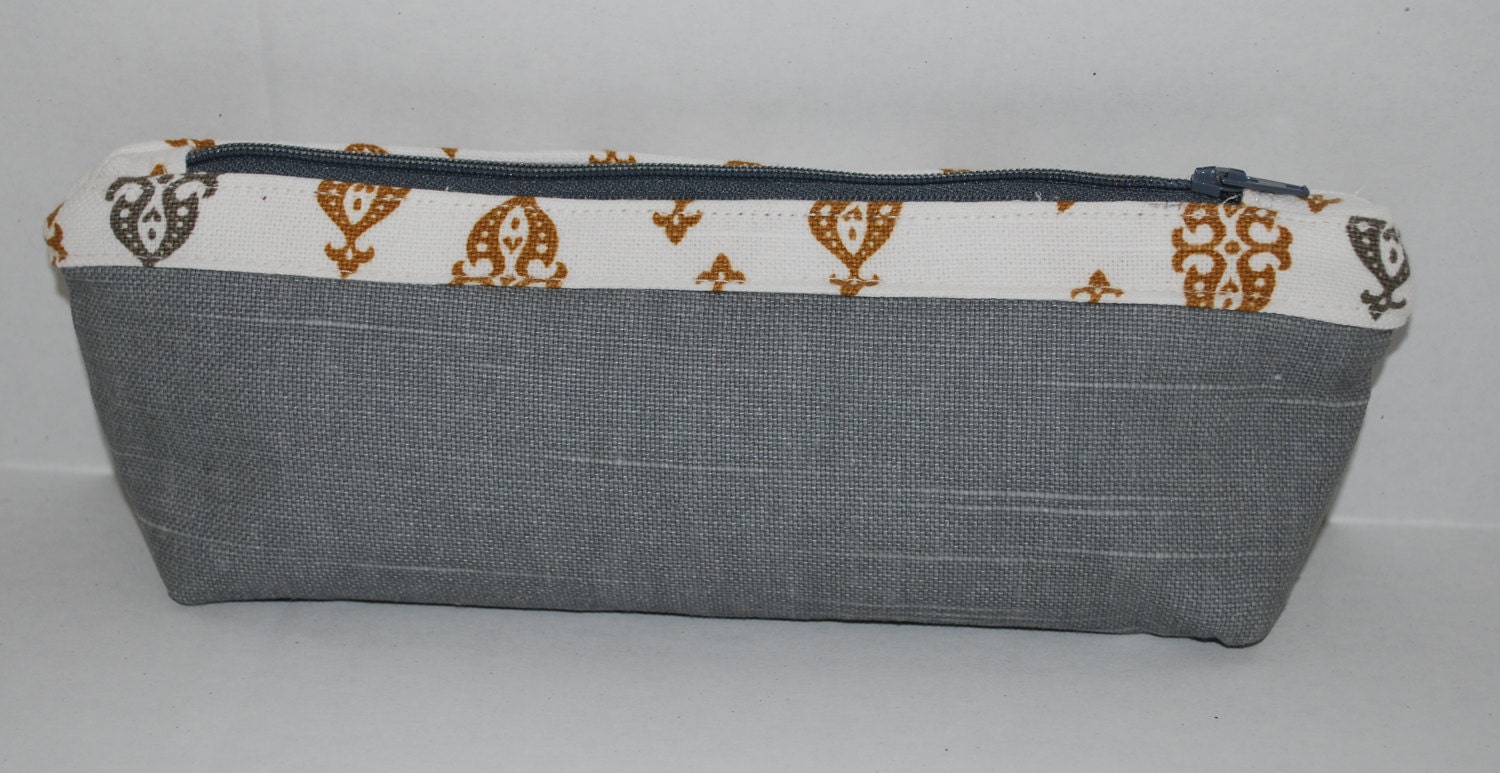 Grey and gold patterned zippered novelty pencil pouch