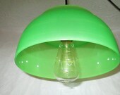 unique pendant light, green glow, modern lighting, minimal design