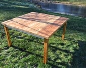 A Square Reclaimed Heart Pine Farm Table.