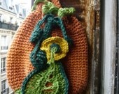 handmade crocheted jute twine pumpkin bag,tote, colourful,orange,yellow,green,with a flower and a leaf.