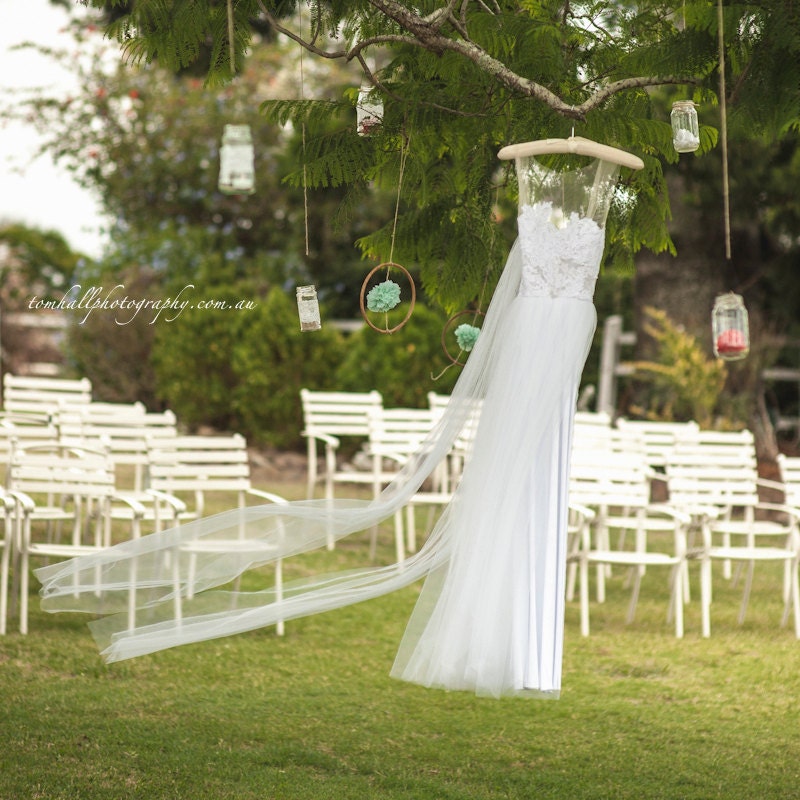 Magical white lace wedding dress with soft tulle skirt and invisible neck line