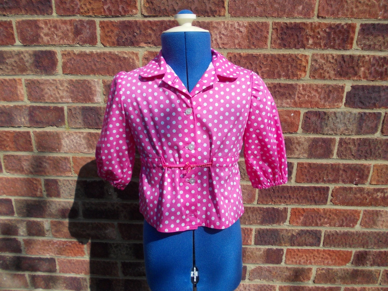 Girls pink and white spotty blouse