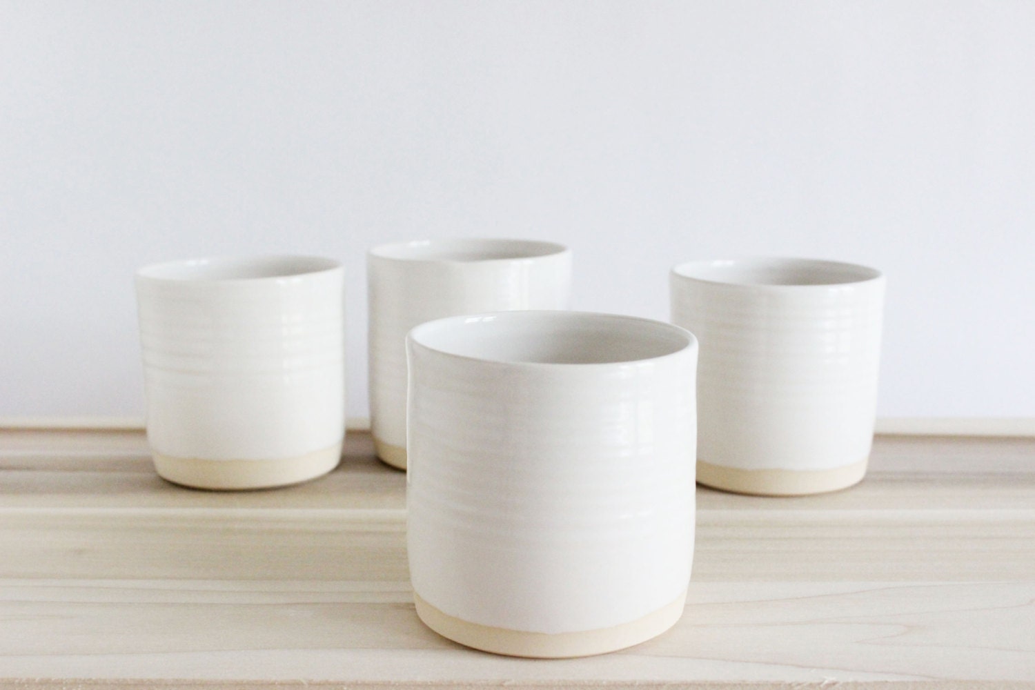 Set of four pottery cups, ceramic tumblers, white ceramic pottery