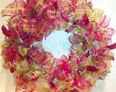 15 inch wreath made with wire edged ribbon.