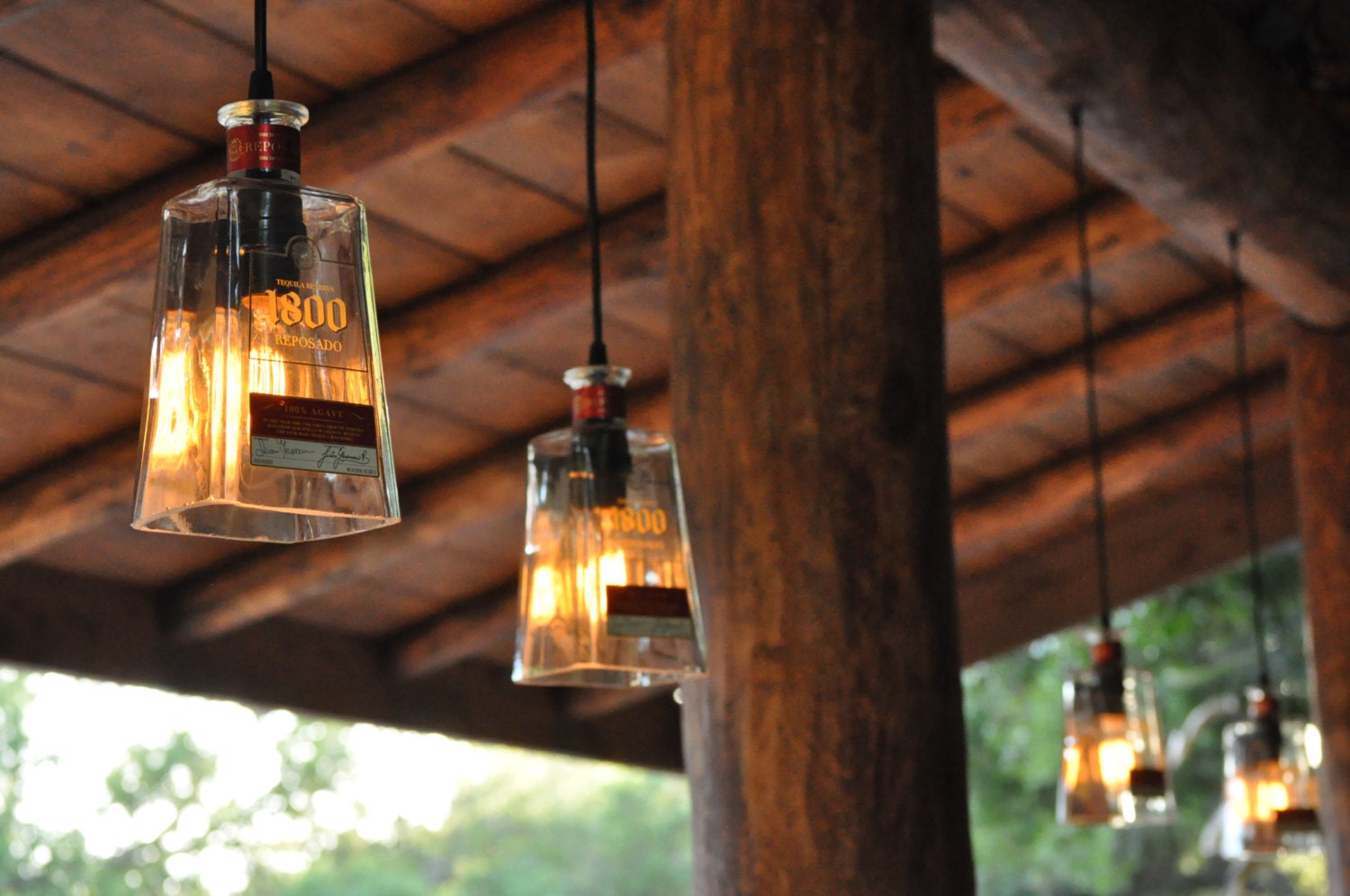 Recycled 1800 Tequila Bottle Pendant Lamp with old fashioned light bulb