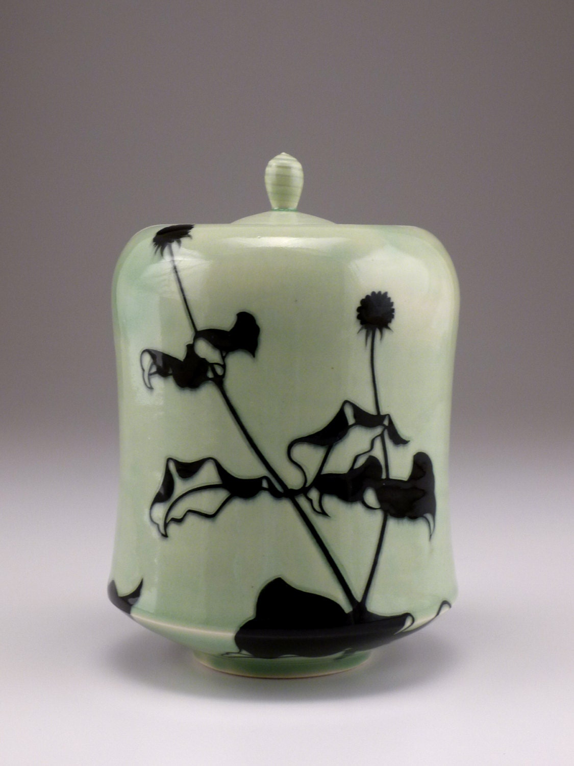 A small urn/ lidded jar