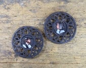 Two Vintage Amish Couple Cast Iron Trivets
