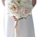 Vintage wedding bouquet, oldworld charm of lace and pearls among paper flowers and seafaom, blush pink and pastel peach fabric flowers