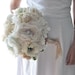 Vintage wedding bouquet, oldworld charm of lace and pearls among paper flowers and seafaom, blush pink and pastel peach fabric flowers