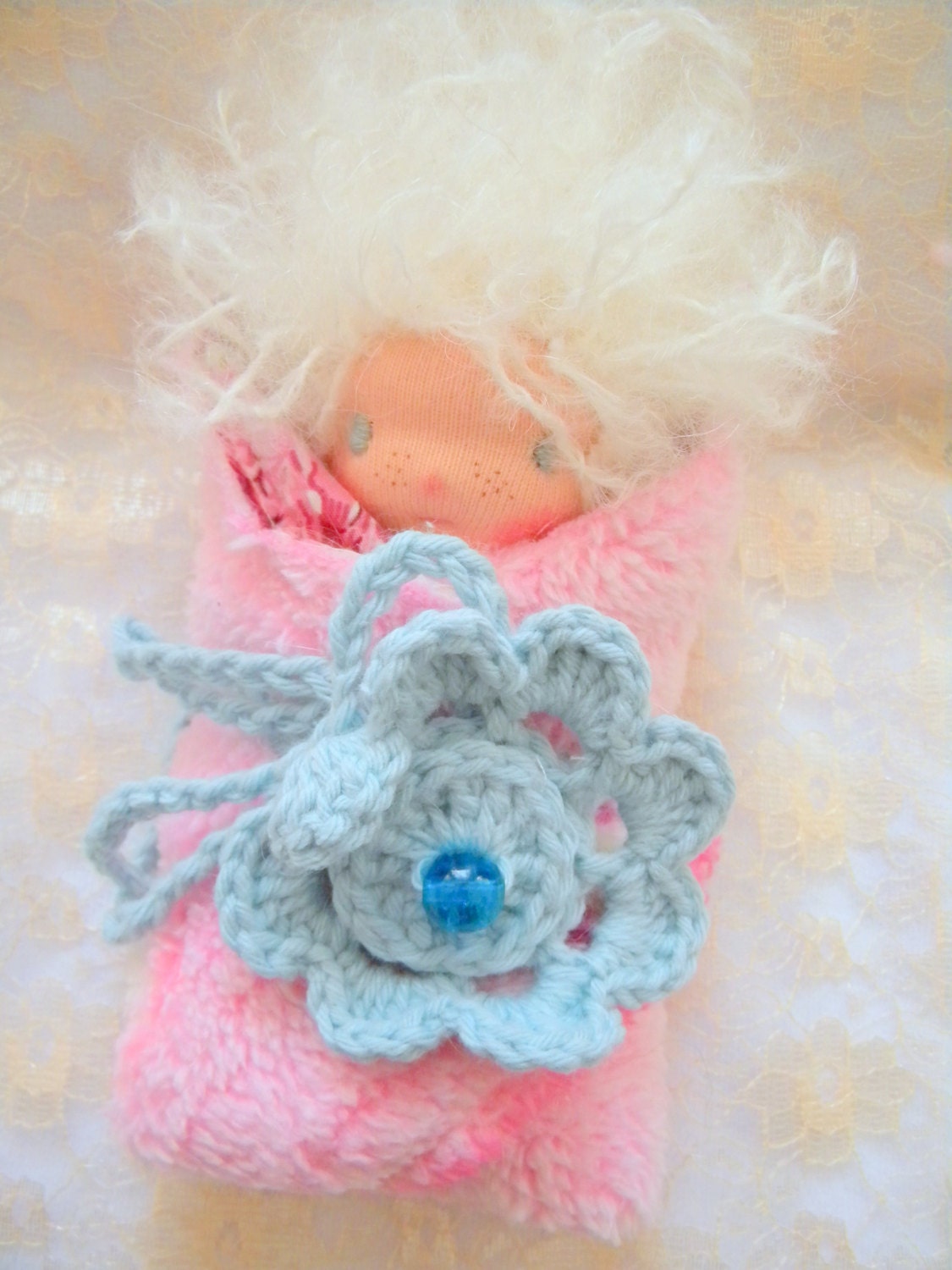 Wolfgang is a beautiful little 5 inches  Waldorf doll with blanket and flower.
