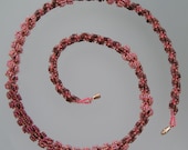 Woven beaded spiral necklace: cocoa and coral glass beads