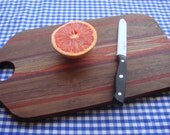 AWESOME 16 inch Black Walnut cutting board or serving board, with some Purple Heart and Padauk (orange wood)