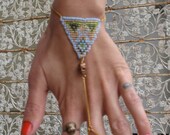 beaded triangle slave bracelet with skull bead