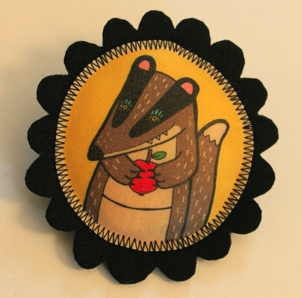 Badger with apple felt brooch, illustrated and handprinted