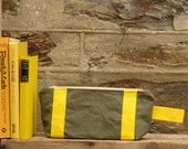 Bright and bold Zip pouch/ toiletry bag. Ticking stripe lining. Forest green washed thick canvas. Yellow accents, and a YKK brass zip.