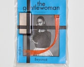 vacuum sealed IPOD and orange HOT TOPIC hair extension on the Gentlewoman Magazine