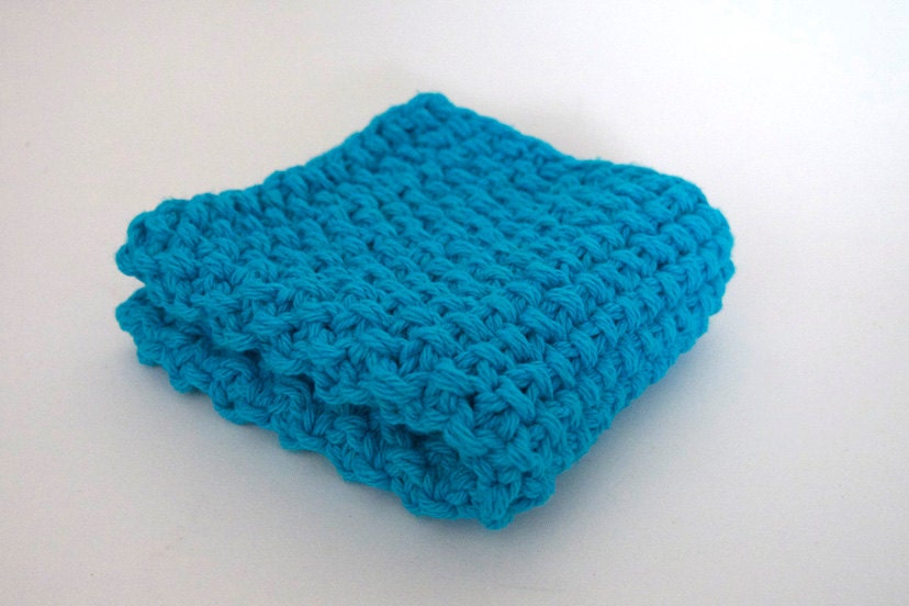 hand knit plushy cotton washcloth in bright aqua blue