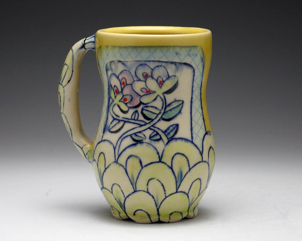 Tall Yellow 20 oz Mug with Floral Decoration in Blue, Green, Purple and Red