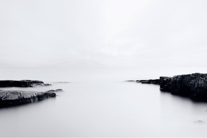 Fine art archival print black and bright white light blue sky morning sunrise landscape photograph stones  rocks water  Baltic sea Sweden - KennethRimmGallery
