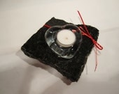 Glass Heart shaped tea light candle holder on Black granite