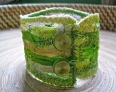 neon green recycled fabric cuff w/ green buttons
