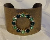 Brass Cuff Bracelet Adorned with Vintage Rhinestone Emerald Green Circle Jewel