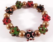 Flexible stretch bracelet, red, green and black lampwork, gold pearls, handmade beaded bracelet, beadwork