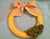 Mustard Yellow 12 Inch Yarn Wreath with Burlap Bow and Olive Green Felt Rosettes.