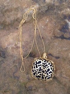 Brass layered in 24k Gold Plating, 18" long necklace with 100% Spun Silk Inside Charm,