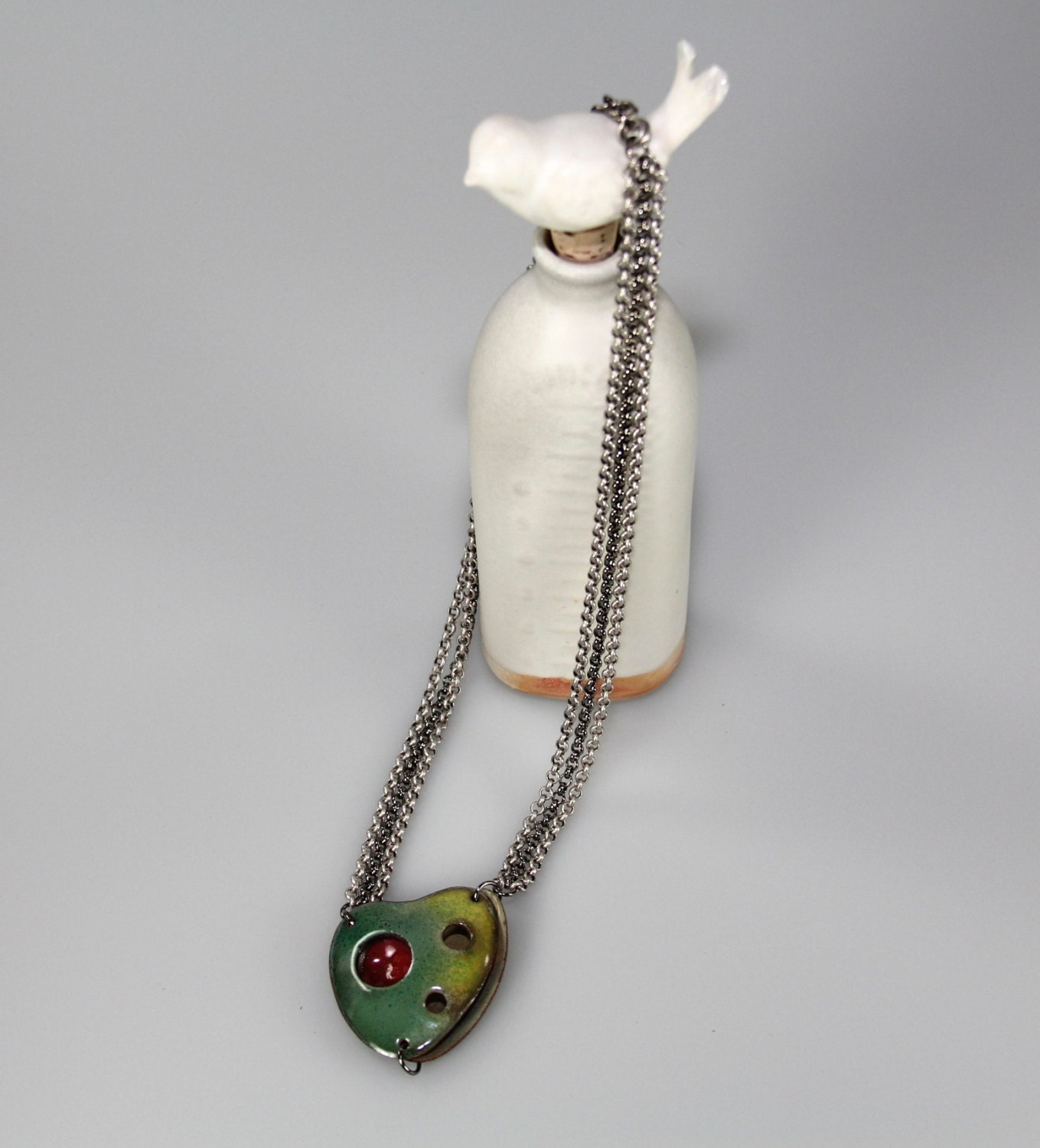 necklace of enameled, formed copper pendant, on silver and gunmetal plated brass chain .