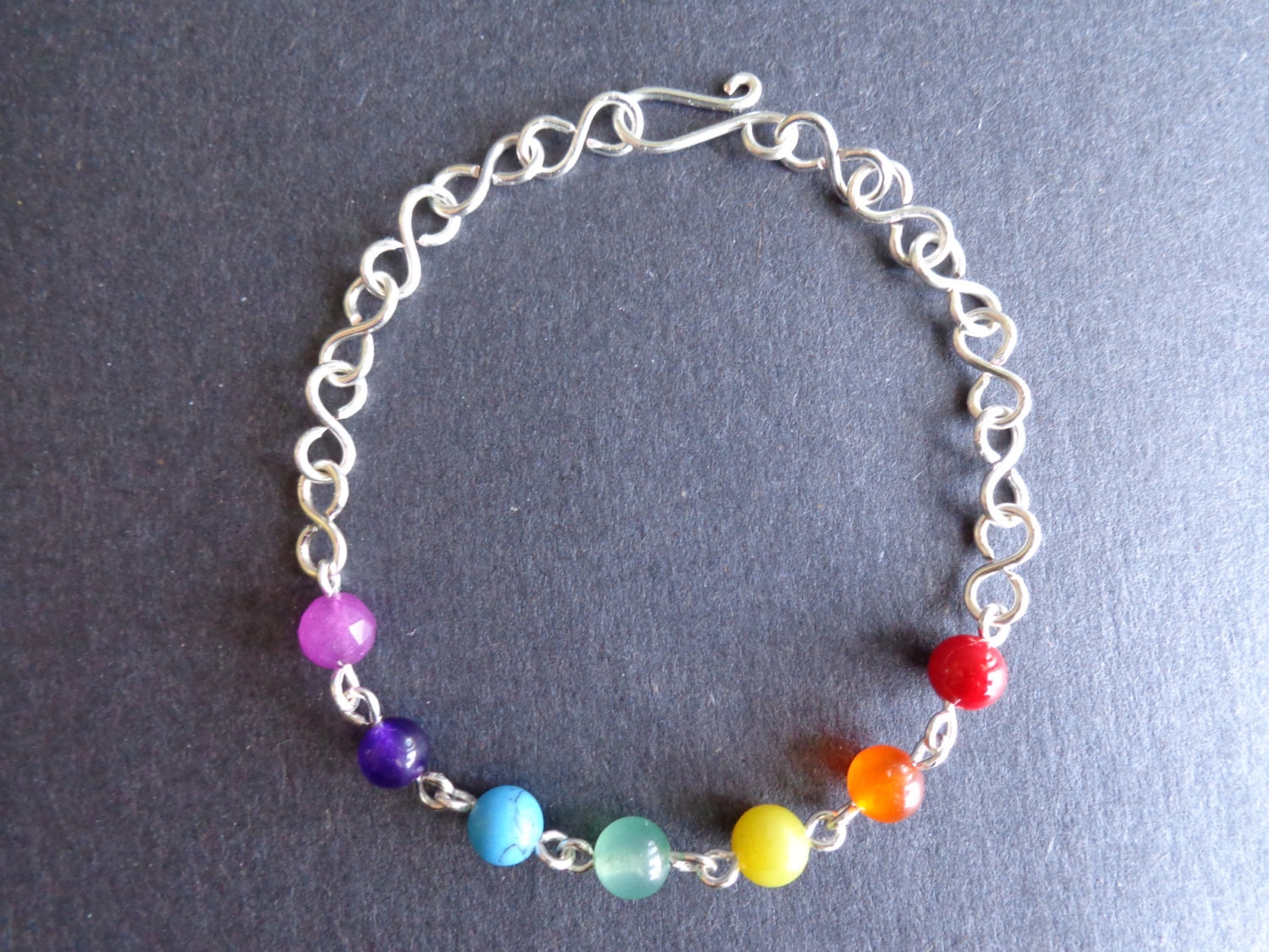 Seven Chakras bracelet, wire wrapped, gemstone beads, silver plated wire, handmade by Iris Jewelry Creations.