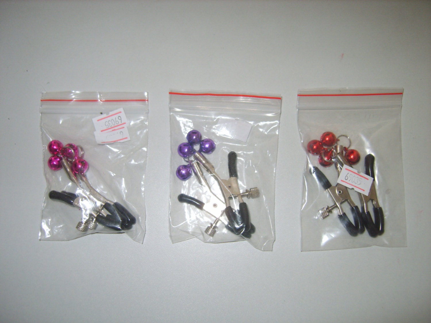 nipple clamps with pink jingle bells :) fetish bondage kink