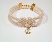 Ivory cream double infinity knotted nautical rope bracelet with gold anchor charm