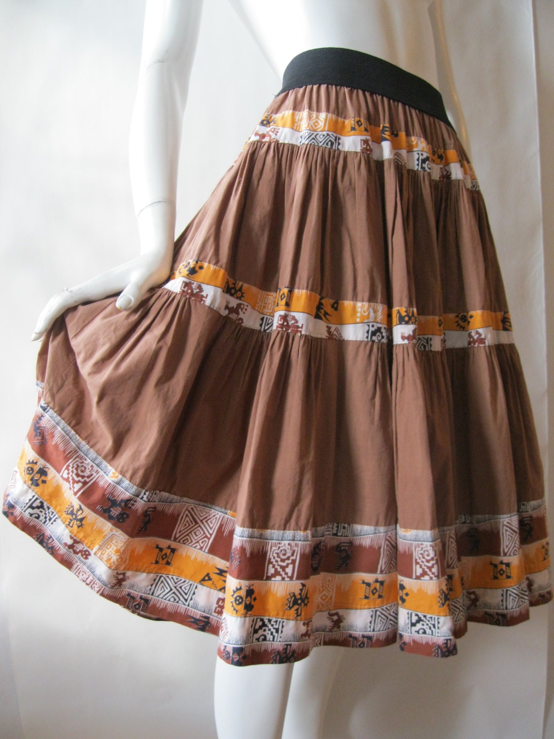 1950's squaw skirt in milk chocolate brown with orange, black, and white Navajo print stripes, small / medium