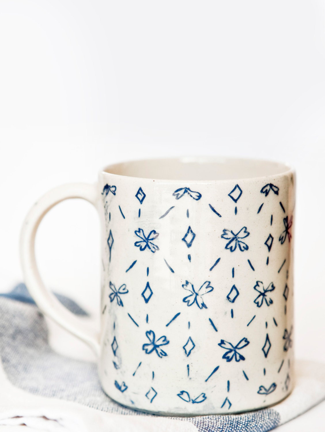 Floral Pattern /306  Slip decorated Ceramic Cup.