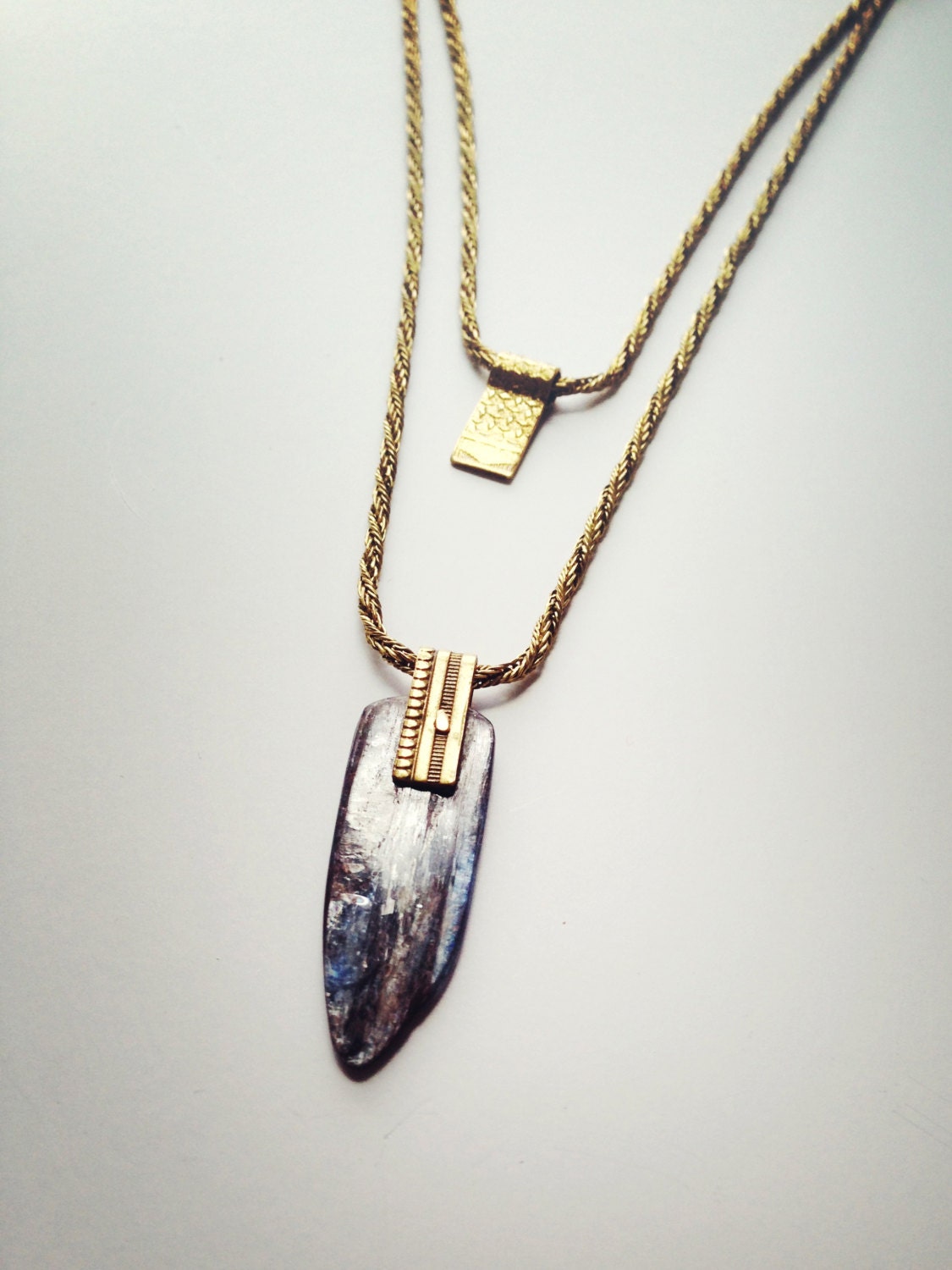 Two-Tiered Brass Diamonds and Kyanite Pendant