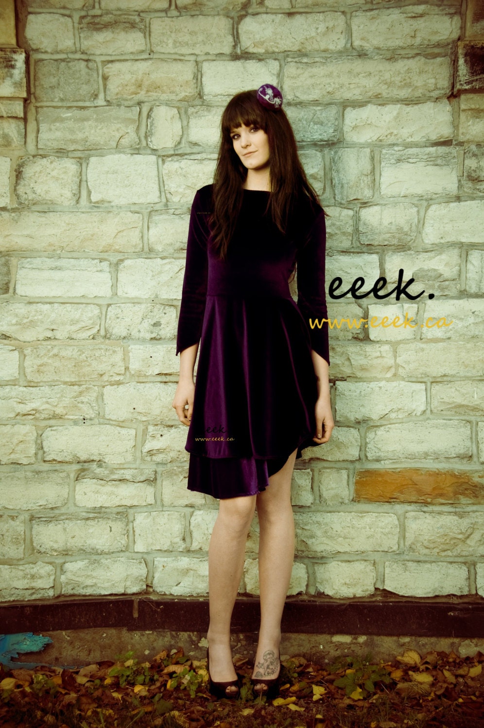 Purple velvet dress with boat neck and empire waist with a-symetrical hem by eeek