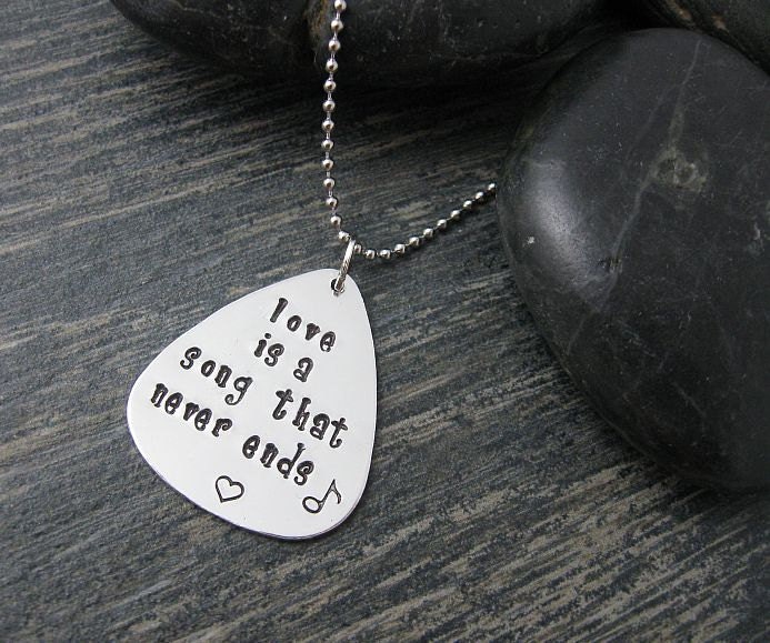 Hand Stamped guitar pick Necklace : Song that Never ends
