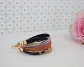 Zaveri bracelet in pink - Cotton, silk and leather bracelet with gold, orange and pink