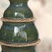 Progression - A sculptural porcelain vase in emerald