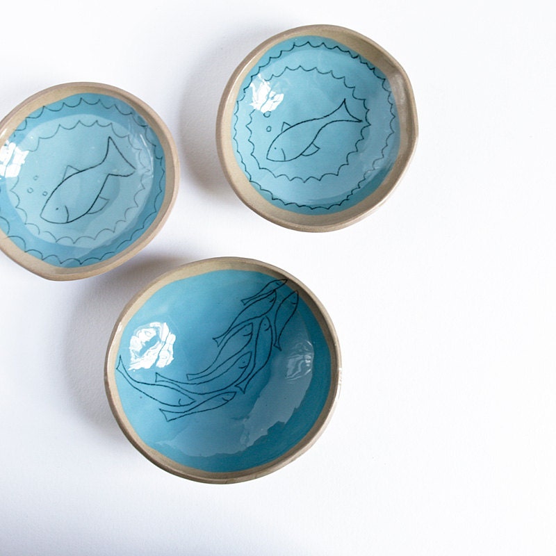 cat food bowls, set of three handmade ceramic bowls for pets, beige and blue, decorated with handsketched fish. karoArt, handmade in Ireland