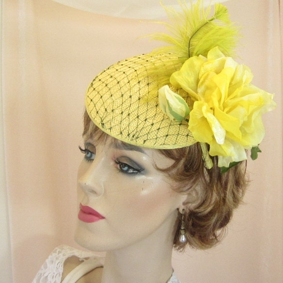 Yellow straw cocktail hat for wedding or garden party
