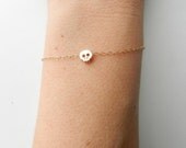 Itty bitty Gold skull bracelet