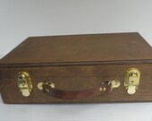 The Magic Suitcase Deck Box holds 12 Standard Sized Decks plus Playmat