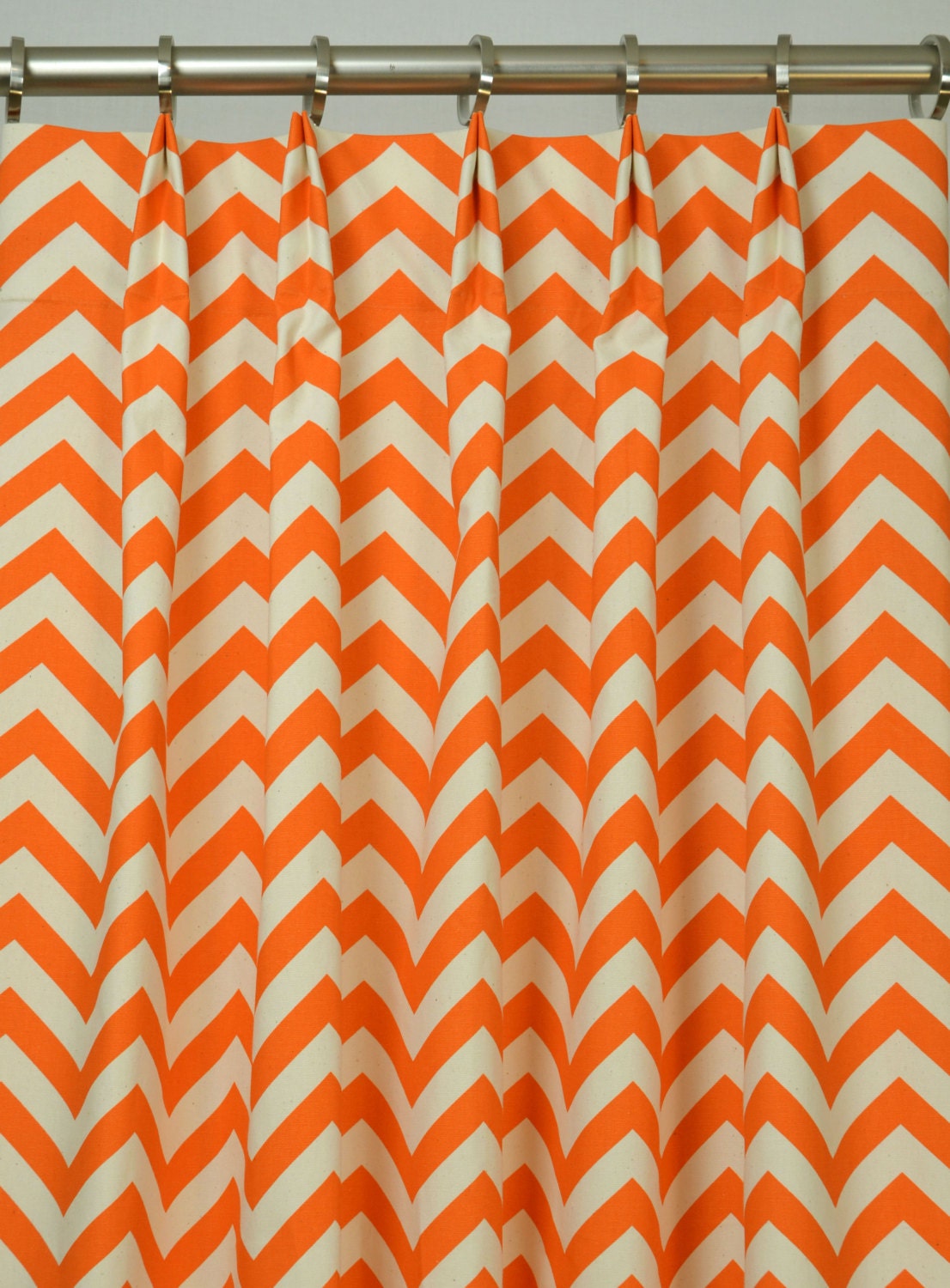 Pair of Pinch Pleat Top Curtains in Mandarin Orange and Natural Chevron Zig Zag Fabric